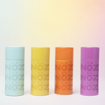 Load image into Gallery viewer, Nöz blue, yellow, orange, and purple tinted sunscreen lined in a row
